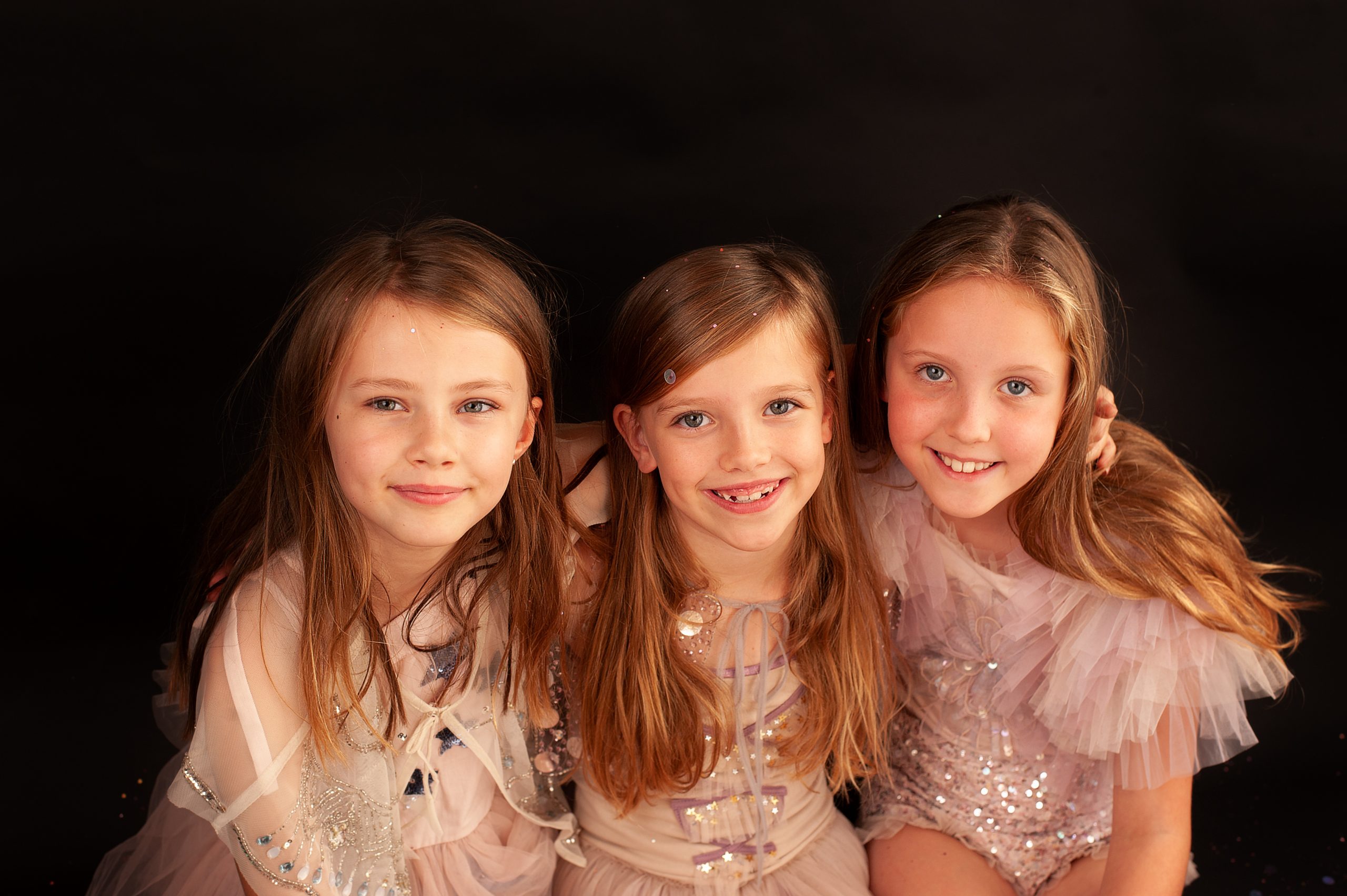 Smiling girls during a photo party