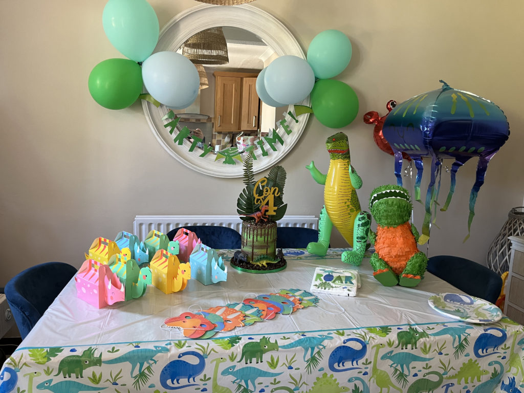 Dinosaur Party, table set up, cake, napkins, plates, balloons